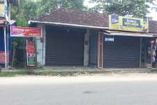 2 cent with shops and lodge east of kalavoor junction roadside .No brockers negotiable